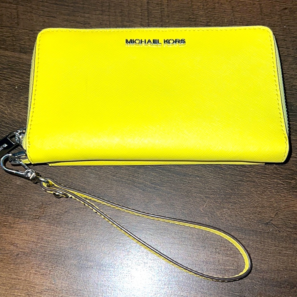 Michael Kors Brand new yellow wristlet w/phone case. Gild hardware.